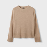 Beige sweater on a light gray background
